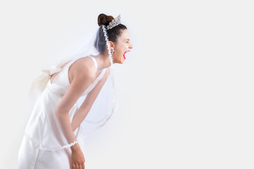 Bride laughing expressively on studio during the photo session. Copy space