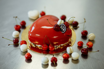 delicious red cake with cherry in the form of heart