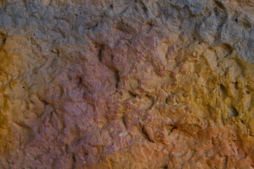 Blurred abstract background. Brown with yellow tuberous cement surface. Beautiful abstract background. Texture of painted cement wall. Brown textured background. Design concept.
