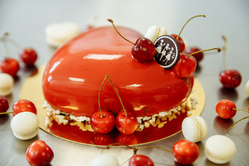 delicious red cake with cherry in the form of heart