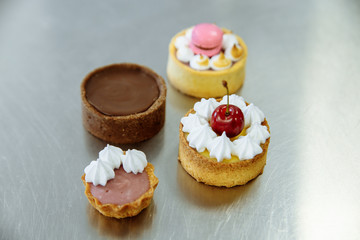 four delicious cherry cakes and macaron