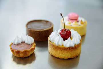 four delicious cherry cakes and macaron