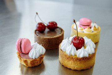 four delicious cherry cakes and macaron