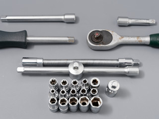 auto repair wrenches on a gray background