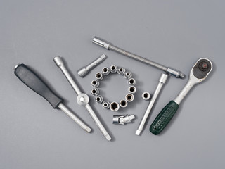 auto repair wrenches on a gray background