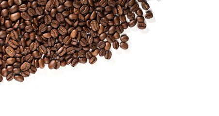 Coffee beans on a white background with place for text.