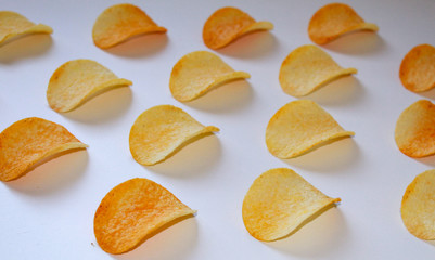 pile of potato chips isolated on white