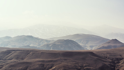 Fototapeta na wymiar Mountain terrain in haze landscape