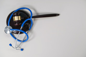 Gavel and stethoscope. medical jurisprudence. legal definition of medical malpractice. 