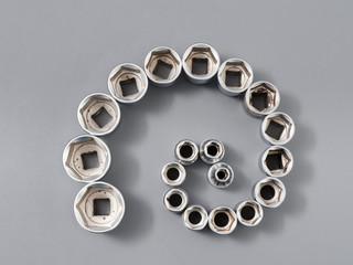 auto repair wrenches on a gray background