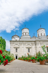 Fototapeta na wymiar Golia Monastery in Iasi, Romania. A landmark church in Iasi on a sunny summer day with blue sky. Iasi historic monument