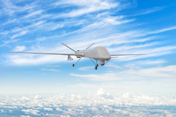 Fototapeta na wymiar Military uav drone flight flies above the clouds.