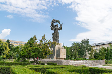 Fototapeta premium Independence Monument in Iasi, Romania. Independence Monument Iasi on a sunny summer day with blue sky. Iasi historic monument