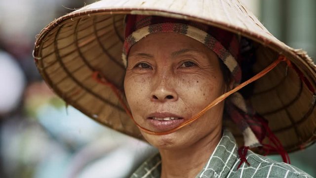 Handheld video shows of Vietnamese senior woman. Shot with RED helium camera in 8K    