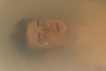 man relaxing on a bathtub