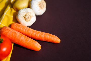 Healthy food concept with fresh vegetables on dark background. Rustic style.