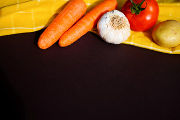 Healthy food concept with fresh vegetables on dark background. Rustic style.