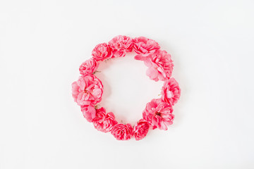 Frame border made of pink rose flowers. Flat lay, top view copy space mockup background.