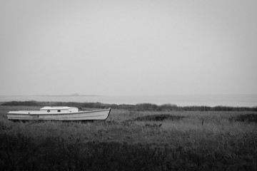 Old fishing boat on Madaket Harbor, Nantucket on a gray day