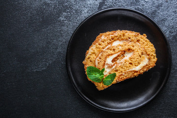 biscuit roll cream and jam (sweet dessert sponge cake) menu concept. background. top view. copy space