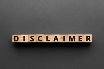 Disclaimer - words from wooden blocks with letters, denial of responsibility disclaimer concept,...