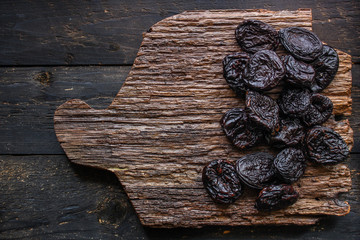 prunes, dried plums (tasty and healthy fruits) menu concept. background. top view. copy space