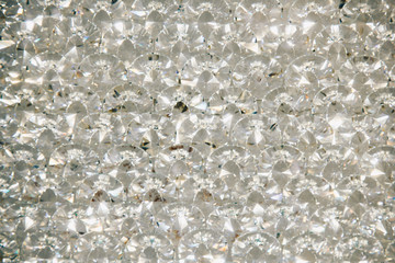 Beautiful shiny diamonds swarovski crystal background. Luxury, wealth. Cover pattern. Macro photo, close up of expensive stones.