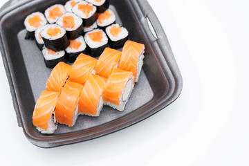 Sushi for a Japanese restaurant on a white background. Valentine's day food background top view. Holiday, celebration, food art concept. Copyspace.