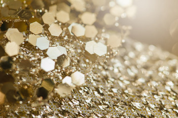 Abstract gold background with copy space. Golden holiday glowing abstract glitter defocused background.