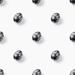 Creative seamless pattern made of easter black eggs on white background. Minimal monochrome food concept.Photography collage