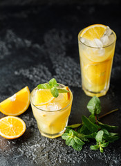 Fototapeta premium Cocktail screwdriver. Homemade orange cocktail with mint and vodka. Rum with orange juice