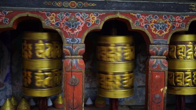 Large prayer wheel in buddhist temple near Namobuddha