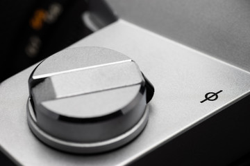 Focal plane mark next to a rewind crank on a retro film camera