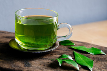 Fresh green tea on grey background.