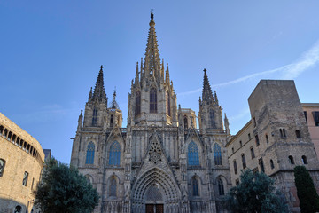 Fototapeta na wymiar Scenic view of The Cathedral of the Holy Cross and Saint Eulalia in Gothic Quarter in center of Barcelona. Beautiful summer sunny look of catholic temple in center of most popular city of Spain