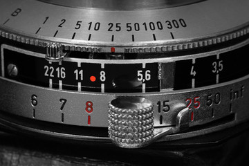 Shutter speed, aperture and focus distance values on a vintage film camera