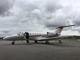 Business jet parked in the airport courtyard awaiting passage