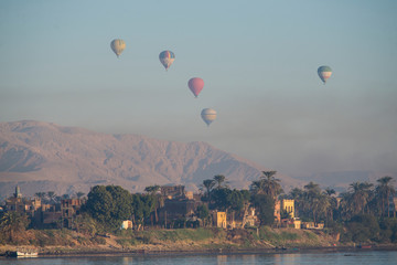 Naklejka premium View of river nile in Egypt showing Luxor west bank with hot air balloons