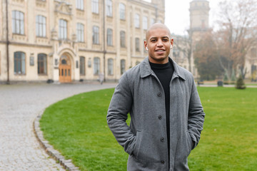 Attractive young african man wearing autumn coat