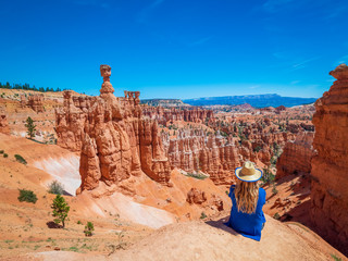 Young woman travels Bryce Canyon national park in Utah, United States, people travel explore...