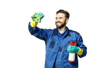 Young handsome man with a beard in the uniform of a cleaner smiles while holding a rag and chemical...