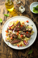Beef steak salad with pasta and vegetables