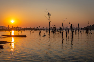Sunset over dry trees, Nam Theun river, Thalang, Thakhek, Laos