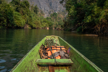 Wooden boat with life vests at Konglor Cave, Thakhek, Laos