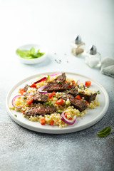 Beef steak salad with pasta and vegetables