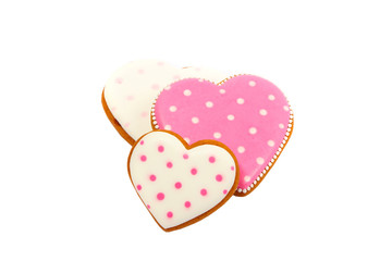 background from pink cookies heart shaped with different patterns, isolated