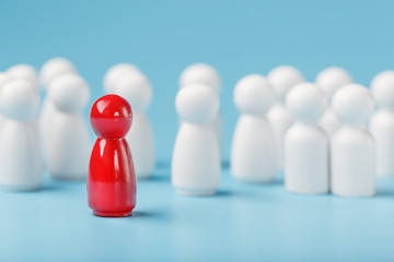 The leader in red leads a group of white employees to victory, HR, Staff recruitment. The concept of leadership.