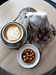 cup of coffee with chocolate and beans