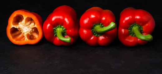 Red pepper on a black background. Paprika. The species capsicum annuum. Copy space