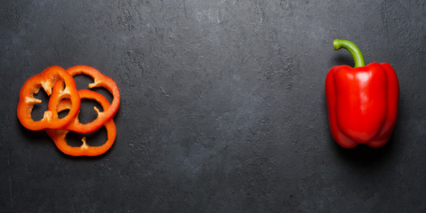 Red pepper on a black background. Paprika. The species capsicum annuum. Copy space